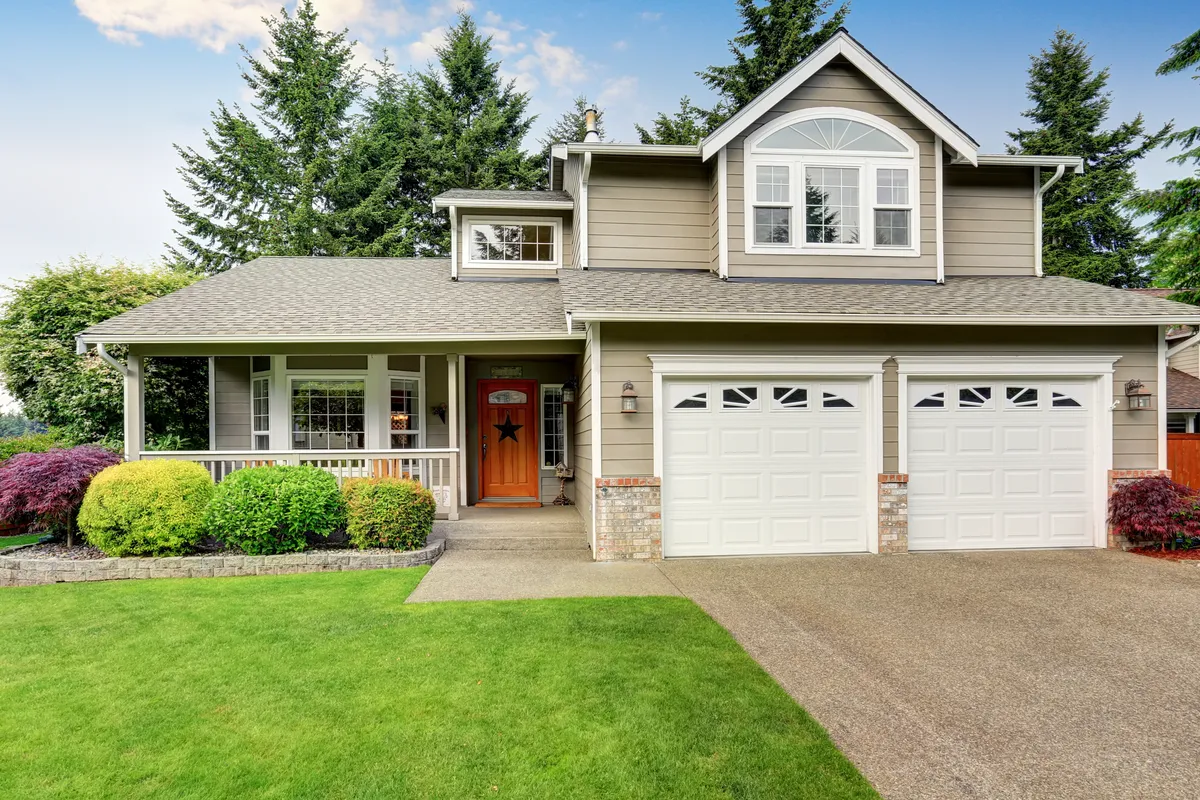 Two-story home with beautiful new siding and covered porch